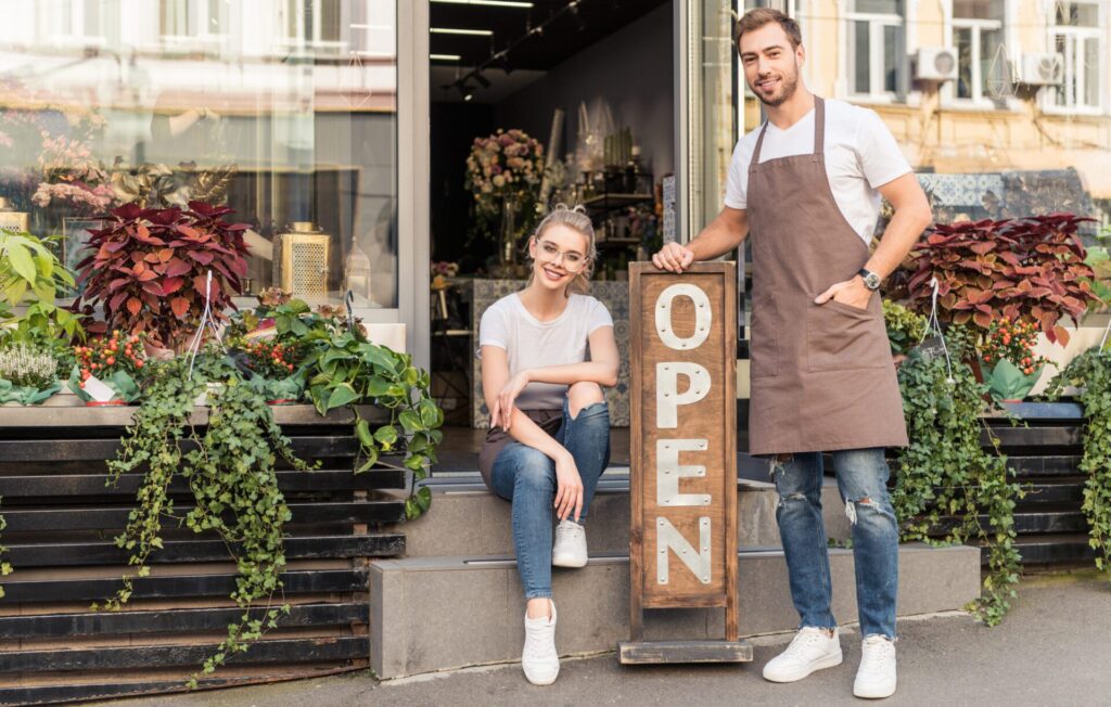 business owners in front of commercial business
